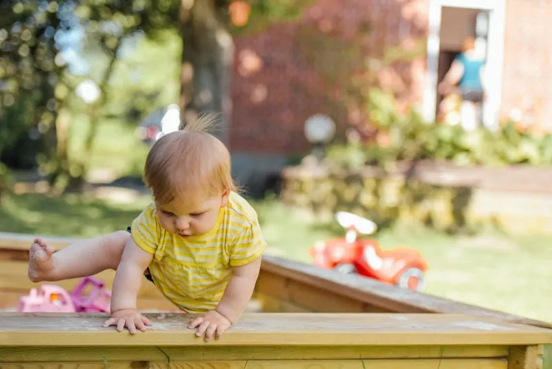 Baby resting in a cot